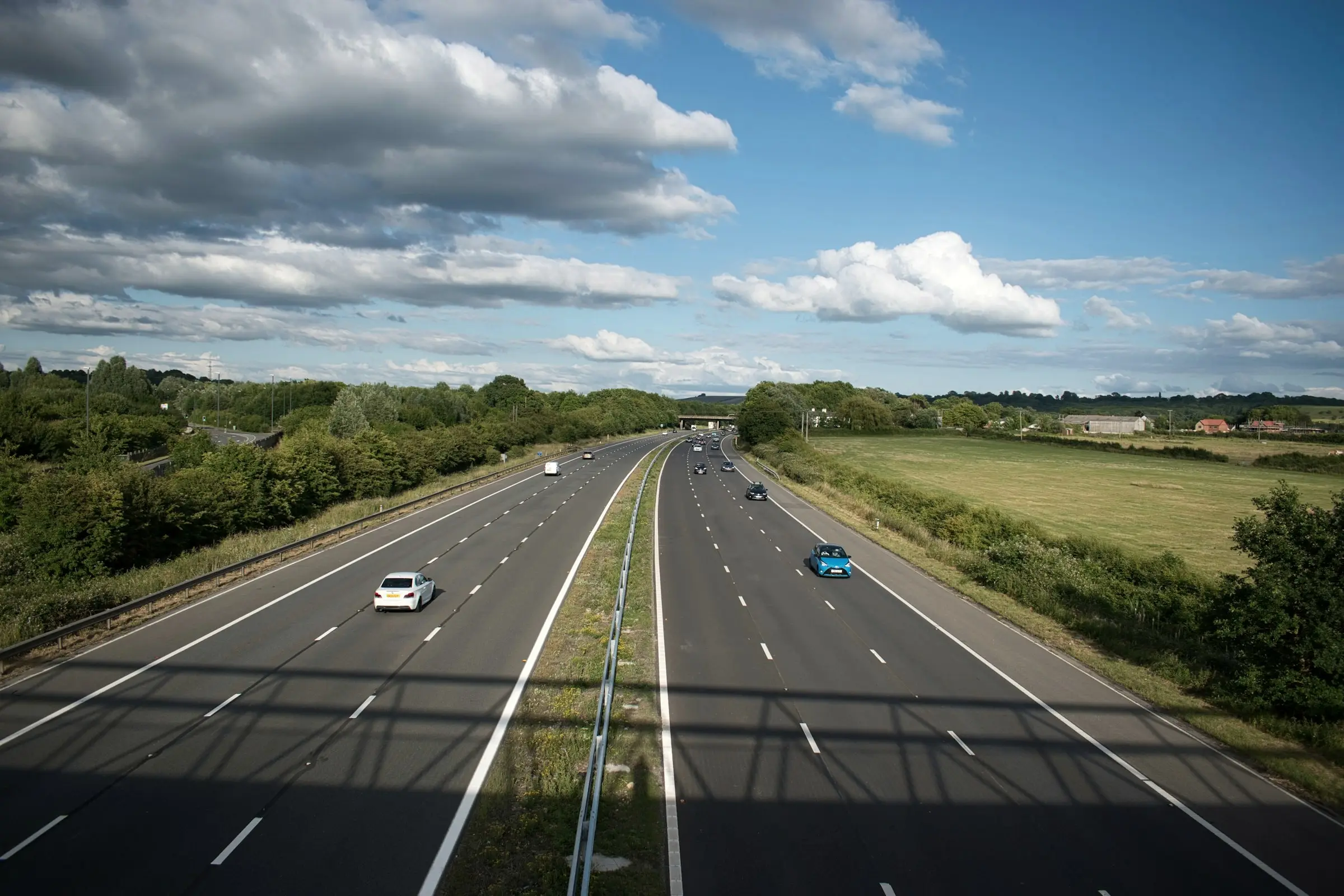 A motorway through green countryside