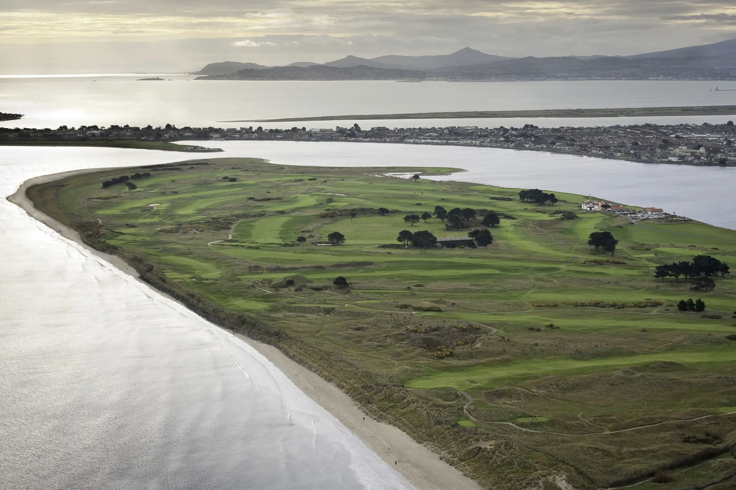 Aerial view of Portmarnock Golf Club on its peninsula north of Dublin, between the estuary and the sea