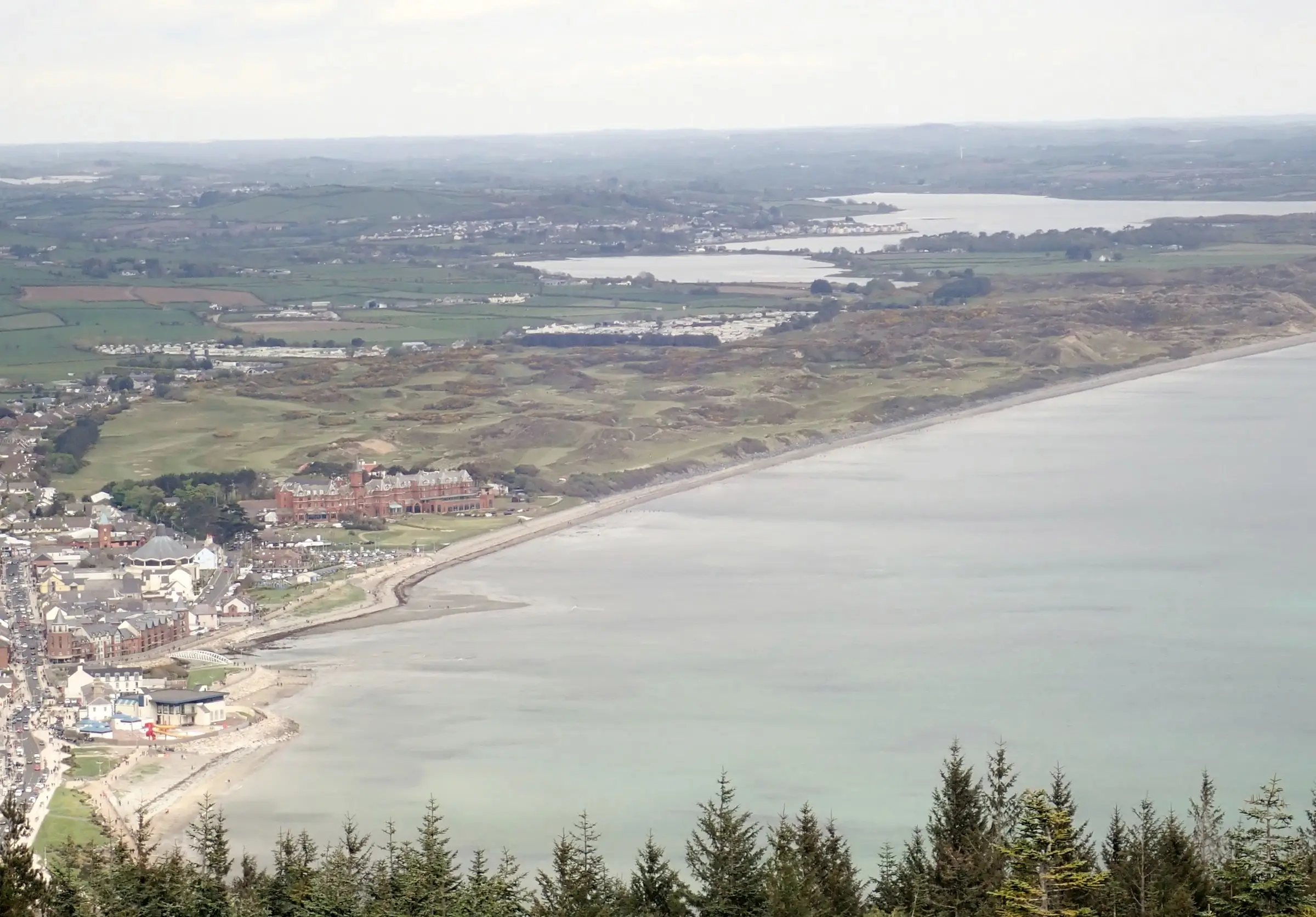 Royal County Down Golf Club and the town of Newcastle seen from Donard Wood, with Dundrum Bay beyond
